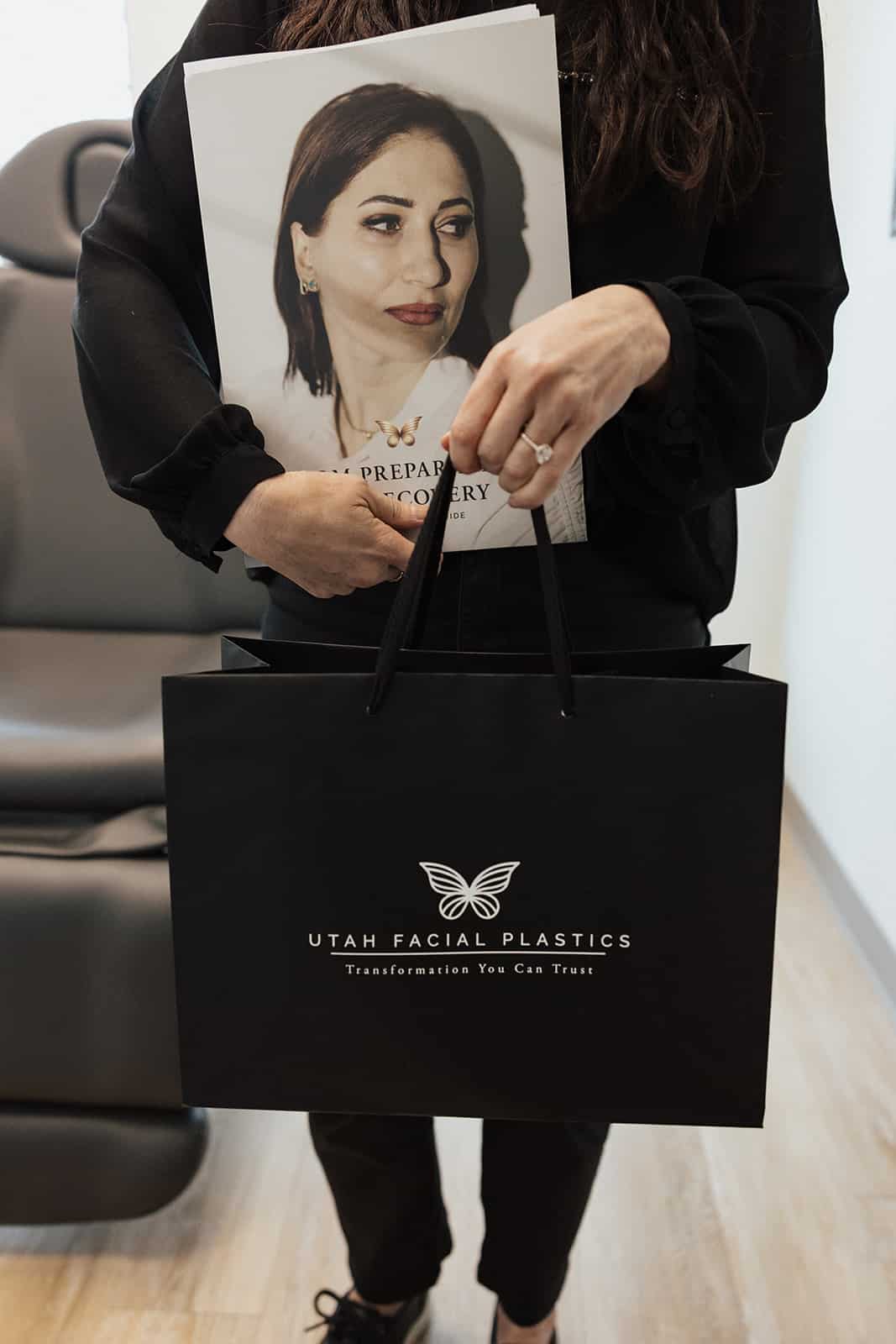 Utah Facial Plastics patient receiving a personalized post-procedure recovery kit and care guide.