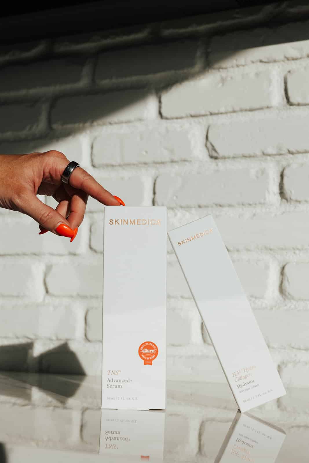 SkinMedica professional skincare products, including TNS Advanced+ Serum and HA5 Hyaluronic Acid Hydrator, offered at Utah Facial Plastics.