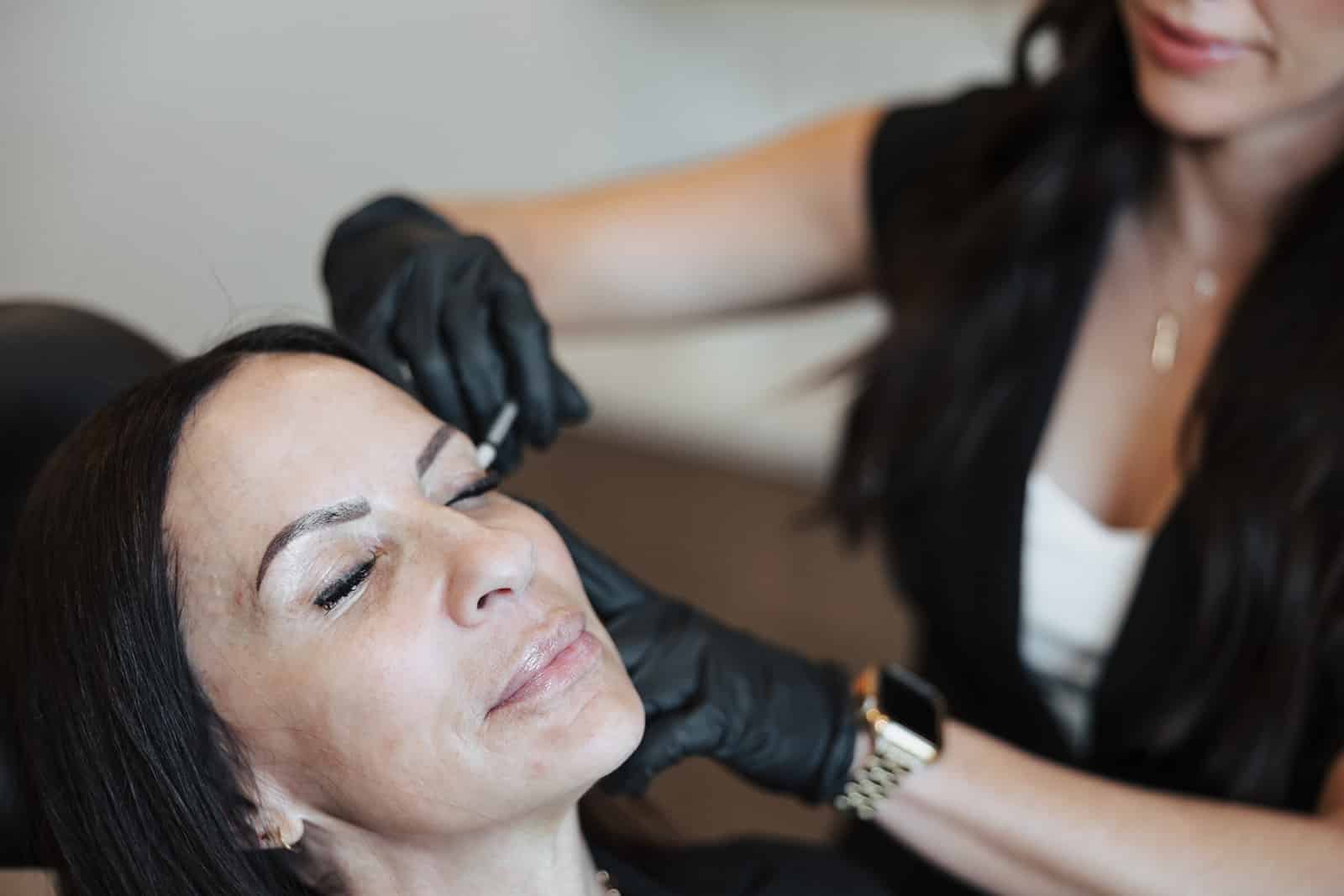 Utah Facial Plastics patient receiving a Botox treatment to the forehead from an aesthetic provider.