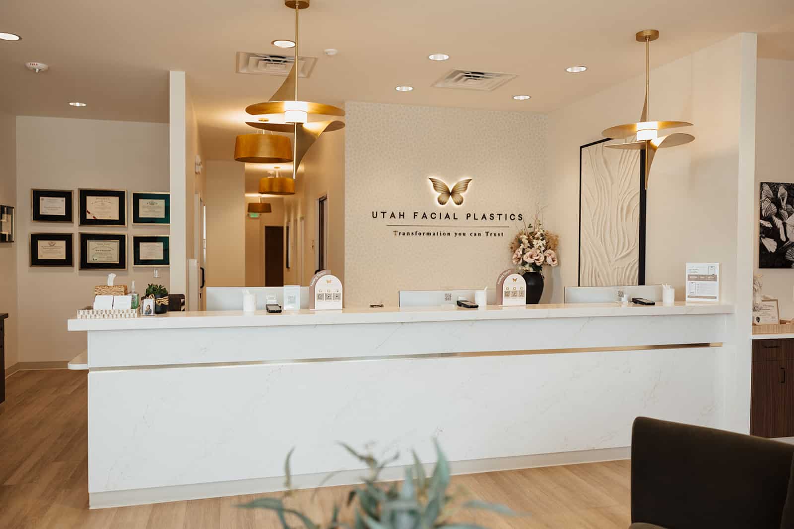 Front desk at the Utah Facial Plastics Layton office, where hair restoration consultations are offered